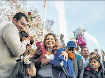  ?? Maria Alejandra Cardona Los Angeles Times ?? MARIA FLORES Alvarado, center, hugs her mother-in-law, Salud Fernandez. The visit was made possible by a program in Mexico that helps parents secure tourist visas to see children living illegally in the U.S.