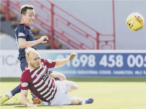  ?? PICTURE: RODDY SCOTT/SNS ?? 0 Hamilton’s Ziggy Gordon is unable to stop Steven Maclean scoring Hearts’ fourth goal.