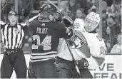  ?? JEFFREY T. BARNES/AP ?? Sabres defenseman Lawrence Pilut and Florida Panthers forward Juho Lammikko battle for position during the second period Thursday night in Buffalo, N.Y.