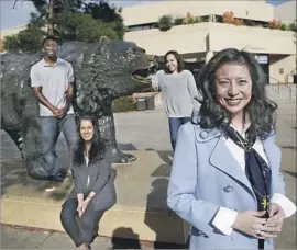  ?? Kirk McKoy Los Angeles Times ?? SHIRLEY WANG, foreground, a UCLA graduate and head of the UCLA Foundation, donated $1 million to the campus for middle-class scholarshi­ps.