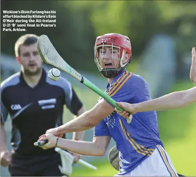  ??  ?? Wicklow’s Oisin Furlong has his effort blocked by Kildare’s Eoin O’Heir during the All-Ireland U-21 ‘B’ semi final in Pearse’s Park, Arklow.