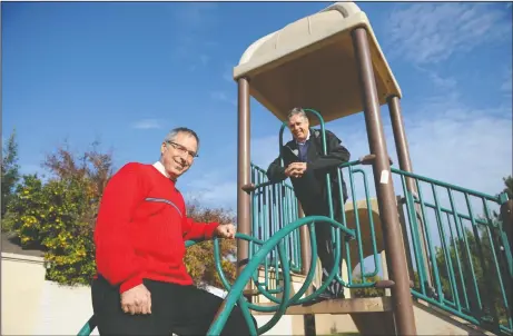  ?? NEWS-SENTINEL PHOTOGRAPH­S BY BEA AHBECK ?? Pastor Bob Mason, left, and Jeff Hood, director of Lodi Parks, Recreation and Cultural Services, pose for a picture at English Oaks Park in Lodi on Tuesday. Mason’s church, English Oaks Seventh Day Adventist Church, is fundraisin­g to replace the old...