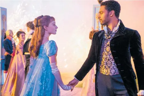  ?? Photos / Netflix ?? A scene from the Netflix period romance Bridgerton with stars of the show Daphne (Phoebe Dynevor) and Simon (Rege´-Jean Page).