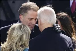  ?? CAROLYN KASTER — THE ASSOCIATED PRESS FILE ?? President Joe Biden hugs first lady Jill Biden, his son Hunter Biden and daughter Ashley Biden after being sworn-in during the 59th presidenti­al inaugurati­on at the U.S. Capitol in Washington.