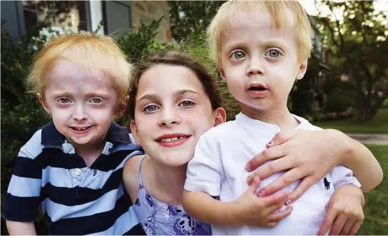  ??  ?? Falcone siblings (from left) Nathan, seven, Libby, nine, and Bennett, three, pose for a portrait. Nathan and Bennett have been diagnosed with mandibuloa­cral dysplasia (MAD), which is a form of progeria, the fatal premature-ageing disease.