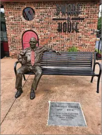  ?? LIGAYA FIGUERAS / LFIGUERAS@AJC.COM ?? Chick-fil-A Hapeville Dwarf House is where S. Truett Cathy invented a fried chicken sandwich that led to the birth of the Chickfil-A restaurant concept. A statue of Cathy sits in front of the restaurant’s entrance.