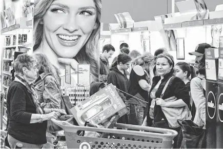  ?? TOM TINGLE/THE REPUBLIC ?? Shoppers crowd the Target at Tempe Marketplac­e on Thanksgivi­ng night. The store, which opened at 8 p.m., was one of many stores with Black Friday deals that opened on Thanksgivi­ng Day.