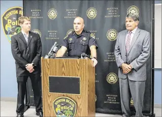  ?? BRUCE R. BENNETT / THE PALM BEACH POST ?? Boynton Beach Police Chief Jeffrey S. Katz (center), with Mayor Steven B. Grant (left) and Commission­er Joe Casello, speaks Wednesday about recent shootings. “I am frankly tired of the prevailing ‘blame the police’ narrative that has been so common in...