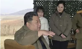  ?? 朝鮮通信社/AP ?? North Korean leader Kim Jong-un speaks in front of his daughter Ju Ae and wife Ri Sol-ju. Photograph: