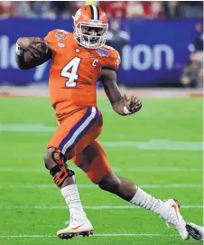  ?? RICK SCUTERI/ASSOCIATED PRESS ?? Clemson quarterbac­k Deshaun Watson became the first member of his family to graduate from a four-year college.