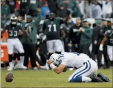  ?? CHRIS SZAGOLA — THE ASSOCIATED PRESS ?? The Indianapol­is Colts’ Andrew Luck reacts after being sacked in the fourth quarter of Sunday’s game in Philadelph­ia.