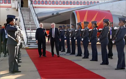  ?? Picture: DIRCO News Service/Jacoline Schoonees ?? ROLLING CARPET: Indian Prime Minister Narendra Modi was welcomed by Tourism Minister Derek Hanekom at Waterkloof Air Force Base in Pretoria yesterday. Modi will attend the BRICS Summit.