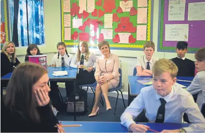  ??  ?? First Minister Nicola Sturgeon meets young people taking part in mental health focused PSE classes at Leith Academy amid statistics showing long waits for treatment.