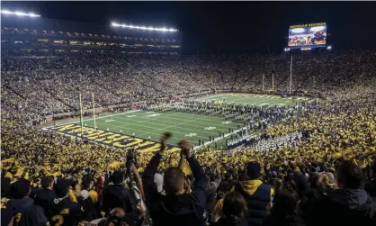  ?? Photograph: Tony Ding/AP ?? Michigan fans, along with thousands who support other teams, will not see their teams play this year.