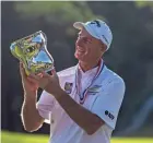  ?? ASSOCIATED PRESS ?? Jim Furyk admires his trophy as he celebrates his victory in the U.S. Senior Open on Sunday in Omaha, Nebraska.