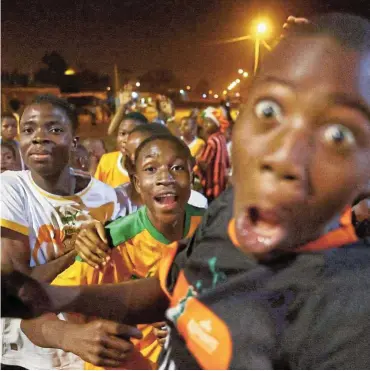  ?? Pictures: Reuters/Siphiwe Sibeko ?? Fans celebrate as Ivory Coast qualify for the Africa Cup of Nations final after beating Democratic Republic of Congo in Bouaké, Ivory Coast.