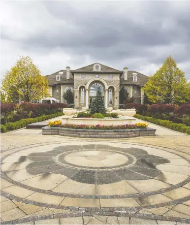  ?? ERNEST DOROSZUK / POSTMEDIA NEWS ?? This mansion in Markham, Ont., near Toronto, was seized as a part of Project End Game because it was allegedly being used as a gaming house, police announced Wednesday. Alcohol worth $1.5 million was also seized inside.