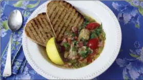  ?? SARA MOULTON VIA AP ?? Clam, tomato and bacon stew with grilled garlic bread.