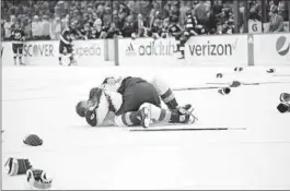  ?? PHELAN EBENHACK AP ?? Nathan MacKinnon (top) and Erik Johnson embrace after winning Stanley Cup.