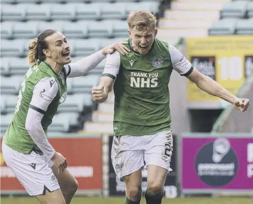  ??  ?? 0 Hibs’ Josh Doig shows his delight as he celebrates with team-mate Jackson Irvine after scoring against Hamilton on Saturday