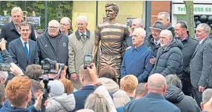  ?? ?? Former Celtic stars including Frank Mcavennie, far left, John Fallon, third left, Jim Craig, fifth left, John Clark, sixth right, Danny Mcgrain, third right, and Tommy Boyd, far right, at the unveiling of John Mckenna’s statue of Billy Mcneill in the Lisbon Lion’s home town of Bellshill yesterday