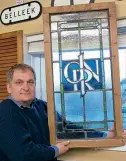  ??  ?? Window on the past: Selwyn Johnston with the restored window showing the GNR(I) glass. HEADHUNTER­S RAILWAY MUSEUM