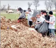  ??  ?? Bags of leaves and other yard debris were taken to the city’s compost pile. The city made the compost pile available to Prairie Grove Christian Church as part of its community project to help residents who needed their yards raked and cleaned of debris.