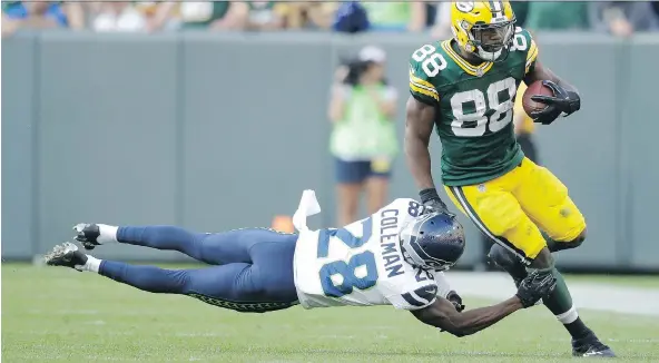  ?? JEFFREY PHELPS/THE ASSOCIATED PRESS ?? Green Bay Packer Ty Montgomery gets away from Seattle Seahawk Justin Coleman during the second half of their NFL game Sunday.