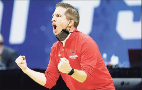  ?? Tim Nwachukwu / Getty Images ?? Coach John Gallagher of the Hartford Hawks reacts during their game against the Baylor Bears in the first round of the NCAA Men’s Tournament at Lucas Oil Stadium on March 19 in Indianapol­is.