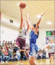  ?? Contribute­d photo ?? Josie Crabtree, left, of Jamestown, Tenn., makes a layup during a middle school game.