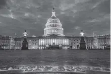  ?? ASSOCIATED PRESS FILE PHOTO ?? Lights shine inside the U.S. Capitol as night falls in Washington on a January evening.