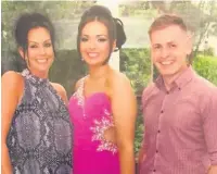  ??  ?? Lydia with her parents Suzanne and David Williams on her school prom day.