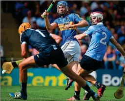  ??  ?? TOO EASY: Tipperary’s John McGrath scores the second of his side’s six goals past Dublin goalkeeper Conor Dooley (left) as Cian O’Callaghan can only watch on