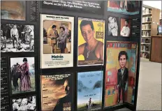  ?? (Caitlan Butler/ News-Times) ?? Film posters highlighti­ng movies Arkansans had a hand in making are displayed as part of the “Lights! Camera! Arkansas!” exhibit currently on display at the SouthArk Library.