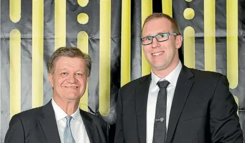  ??  ?? ‘‘It is the exponentia­l growth and disruption from technology which is driving this change.’’ Fletcher Trust chairman Angus Fletcher awards Jarrod Aberhart the Sir James Fletcher Award for Outstandin­g Contributi­on to Enterprise at the Lion Foundation...