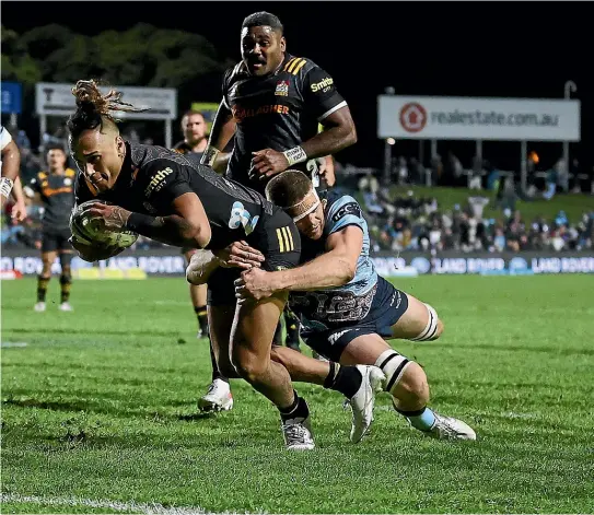  ?? GETTY IMAGES ?? Sean Wainui reaches out to score one of his five tries in a stunning individual performanc­e as the Chiefs ended their Super Rugby campaign with a convincing 40-7 win over the Waratahs in Sydney.