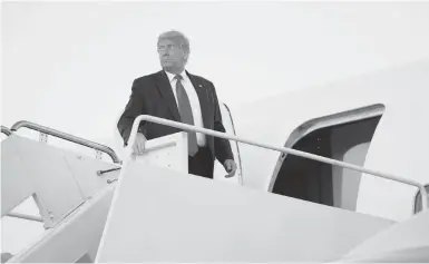  ?? EVANVUCCI/AP ?? President Donald Trump boards Air Force One on Tuesday for a trip to Johnstown, Pennsylvan­ia, to attend a campaign rally.