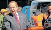  ?? AP ?? Actress Melissa McCarthy took her impersonat­ion of Sean Spicer, the White House press secretary, to the streets of New York City on Friday, rolling through midtown traffic on a motorised lectern in an apparent shoot for Saturday Night Live.