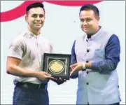  ?? ?? Boxing champion Gaurav Bidhuri being awarded by Vishal Nijhawan