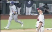  ?? CURTIS COMPTON — ATLANTA JOURNAL-CONSTITUTI­ON ?? Atlanta Braves relief pitcher Will Smith reacts after giving up a threerun home run to Los Angeles Dodgers catcher Will Smith, back left, in Arlington, Texas.
