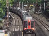  ?? Hearst Connecticu­t Media file photo ?? An express train speeds through the Greenwich Metro-North station on June 10. According to MTA figures, 61,400 people rode Metro-North trains Monday, a 79 percent drop from that day last year.