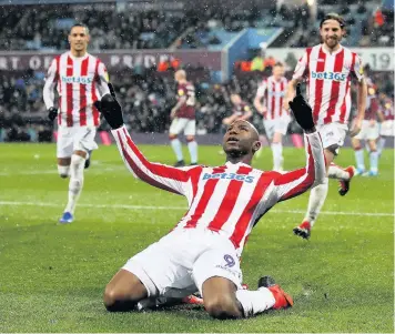  ??  ?? KNEESY DOES IT: Benik Afobe celebrates slotting home from the penalty spot.