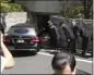  ?? EUGENE HOSHIKO — AP ?? A hearse, believed to carry the body of former Prime Minister Shinzo Abe, arrives at his home Saturday.