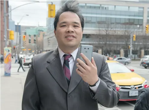  ?? TYLER ANDERSON / NATIONAL POST) ?? Dr. Patrick Yau, the chief surgeon at a company called Slimband, which does weight-loss operations, leaves the College of Physicians and Surgeons following his hearing Wednesday in Toronto.