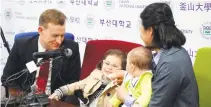  ??  ?? Robert Kelly (L), an expert on East Asian affairs and a professor at South Korea’s Pusan National University, his wife Kim Jung-A (R), daughter Marion (2nd L) and toddler son James (2nd R) attend a press conference at the university in Busan on March 15.