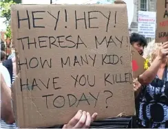  ??  ?? Sick: One of the placards directed at Theresa May