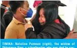  ??  ?? TIMIKA: Natalina Pamean (right), the widow of Oktovianus Rayo, a schoolteac­her who was shot by suspected armed rebels in Beoga district, reacts following the arrival of his coffin in Timika, Indonesia’s Papua province, on Saturday. — AFP