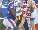  ?? BILL WIPPER/AP ?? Bills linebacker Zach Brown (left) tackles Cardinals tight end Troy Niklas during a game on Sept. 25 in Orchard Park, N.Y. Niklas has eight career receptions.