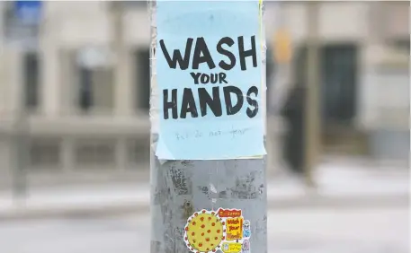  ?? JEAN LEVAC ?? A wash your hands sign was posted on Elgin Street on Thursday as a healthy reminder during the novel coronaviru­s pandemic.