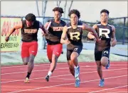  ?? Contribute­d photo by Shelly Culver ?? Tyler Roland and Markus Smith make the handoff during a relay race at the Rome Invitation­al Track and Field event on March 8.